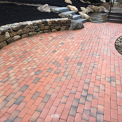Pine Hall brick pavers are perfect for this patio installed by patio designer Nest Outdoors